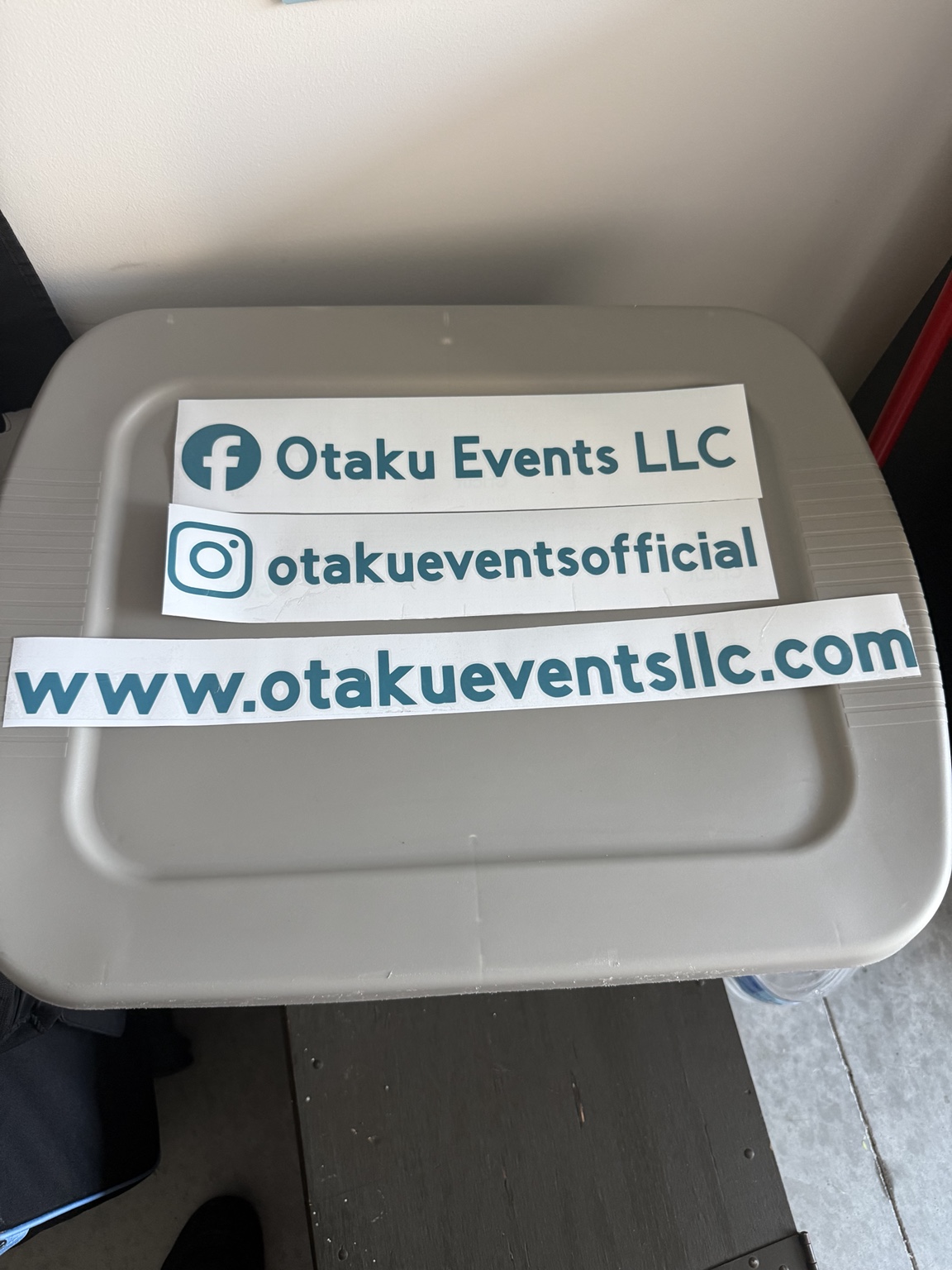 Teal Otaku Events cut vinyl lettering with website and social media handles